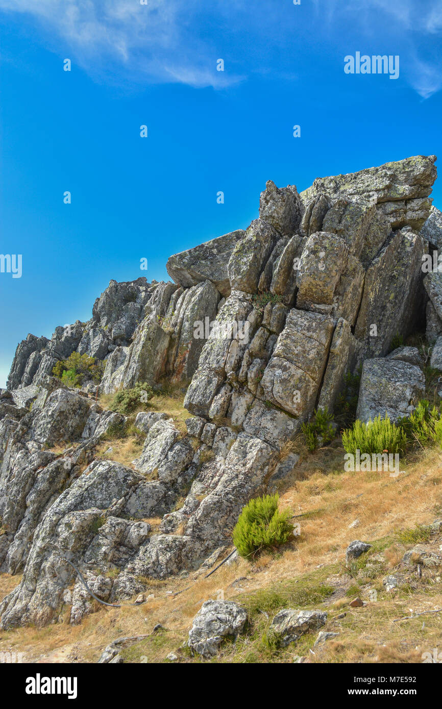 Vertical Long Rocks Huge vertical granite rocks on top at the mountain Stock Photo - Alamy