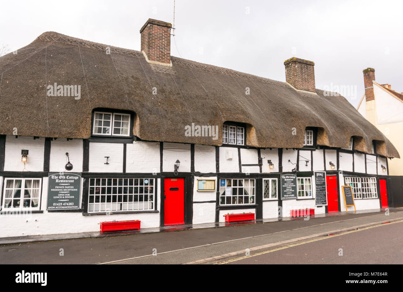The Old Cottage 14th century thatched restaurant on West Street, Ringwood, Hampshire, UK Stock Photo