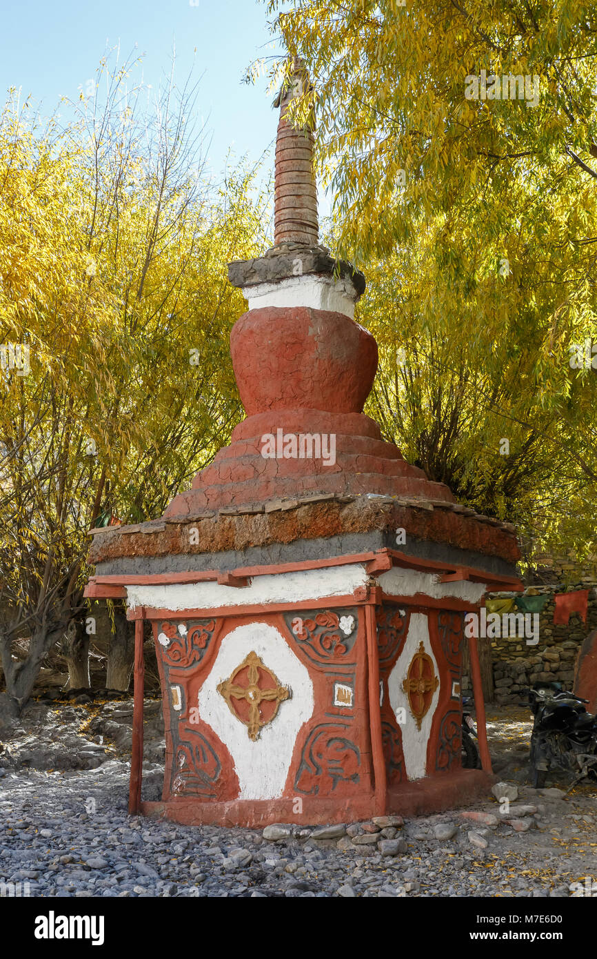Small red tibetan stupa in Lupra village, Himalayas, Nepal Stock Photo