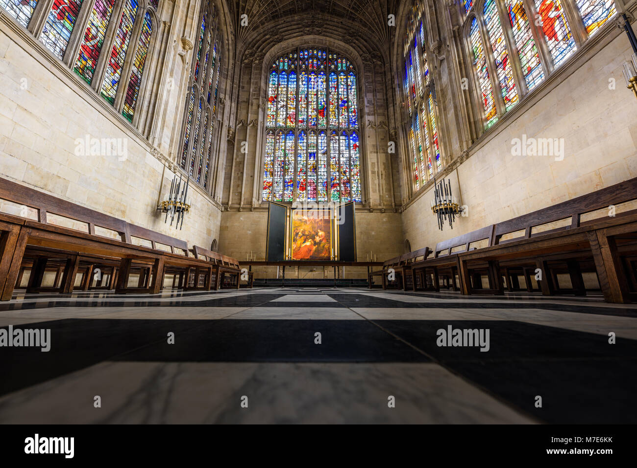 The choir with its floor, stained glass windows, altar, and painting by Rubens in the chapel at King's college, university of Cambridge, England. Stock Photo