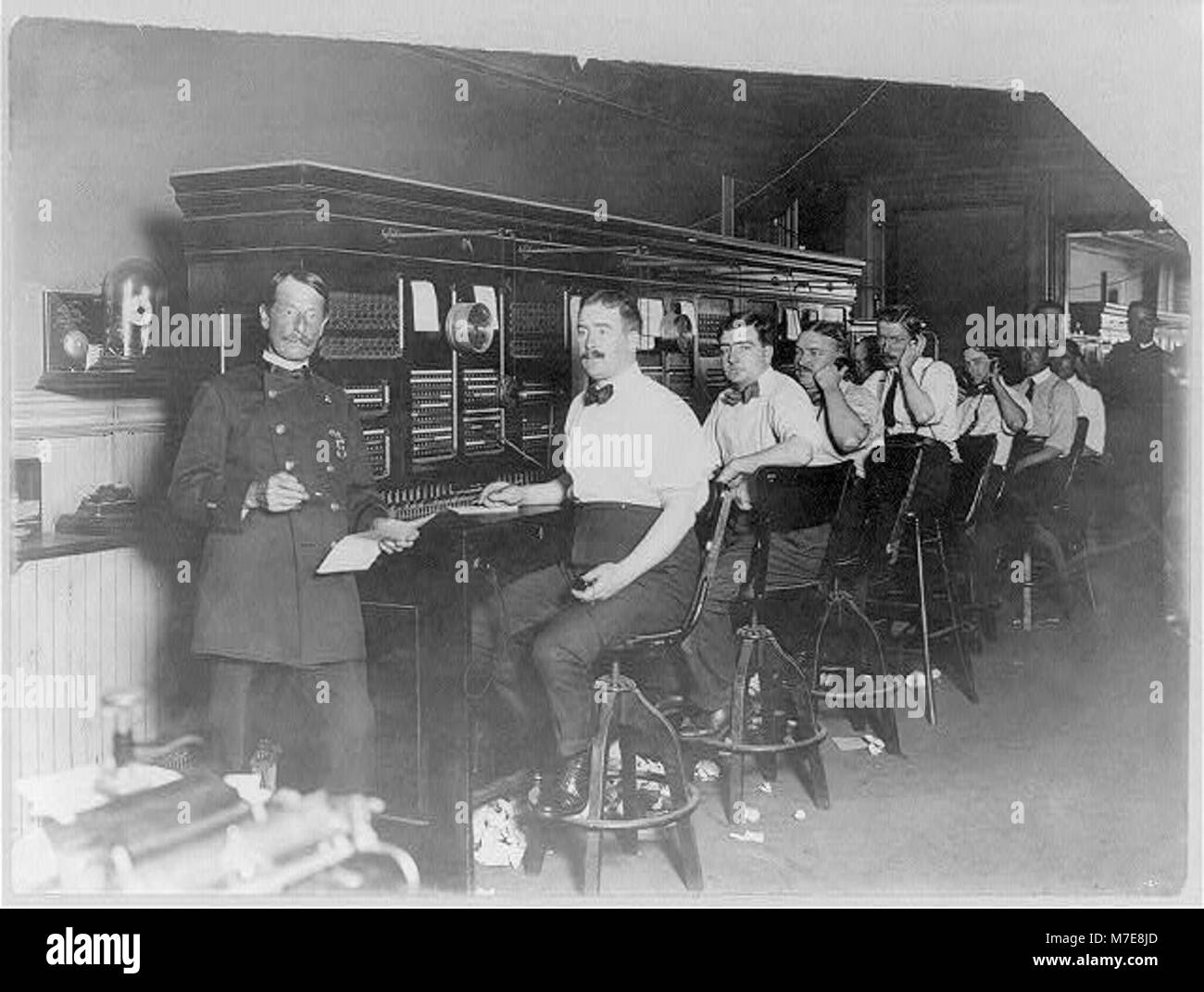 New York (City) Police Dept., 1909 telephone operators (men) lined up