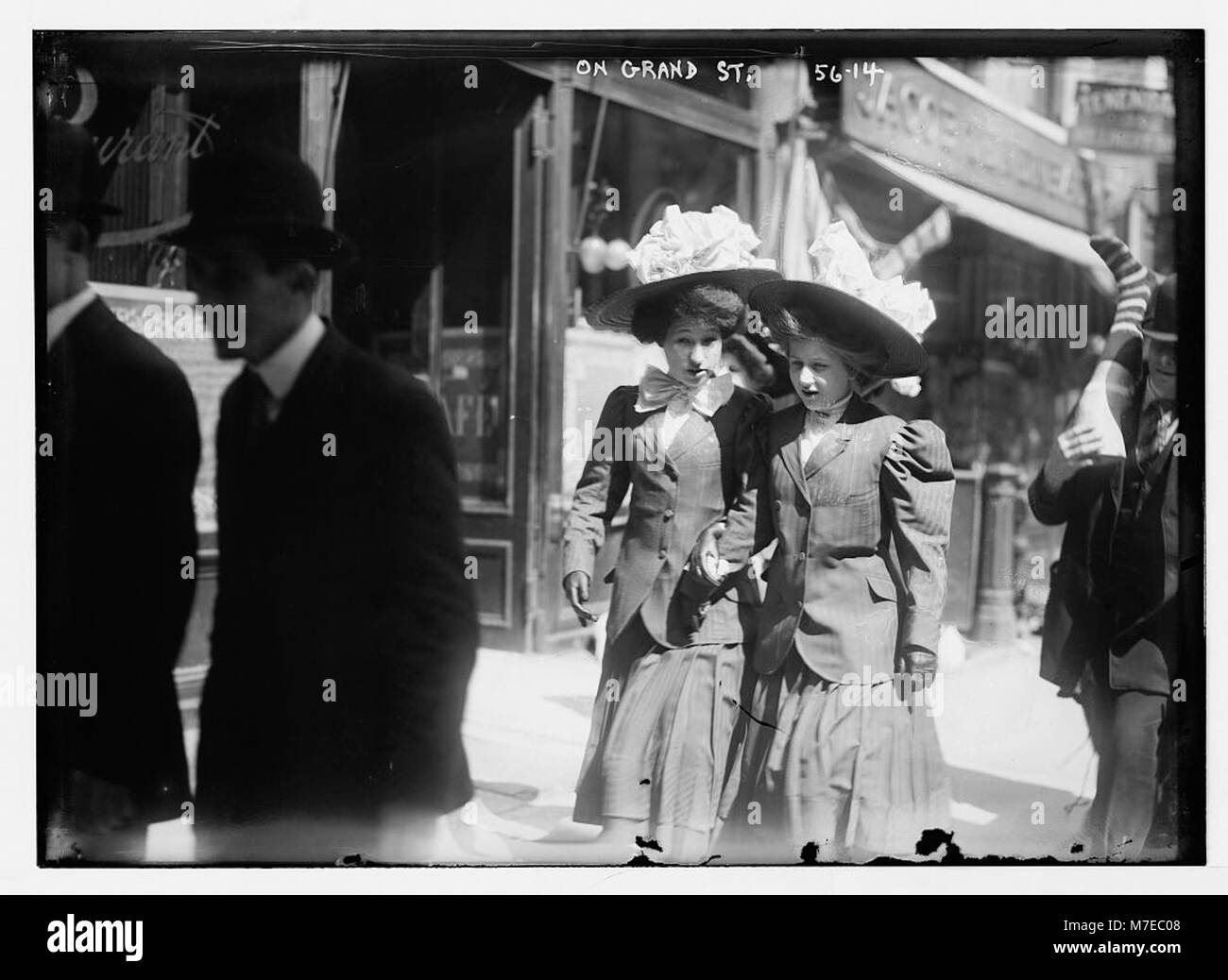This photograph captures a bustling scene on Grand Street in New York