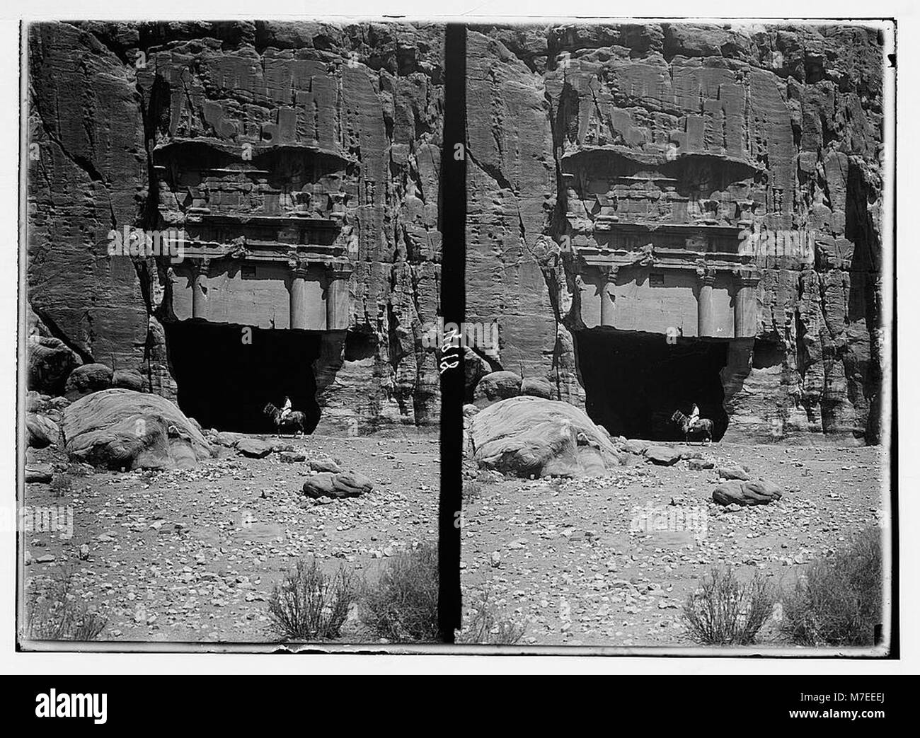 Petra Inscriptions A photograph of Petra's El-M'esrah area, featuring a corniced tomb with ...