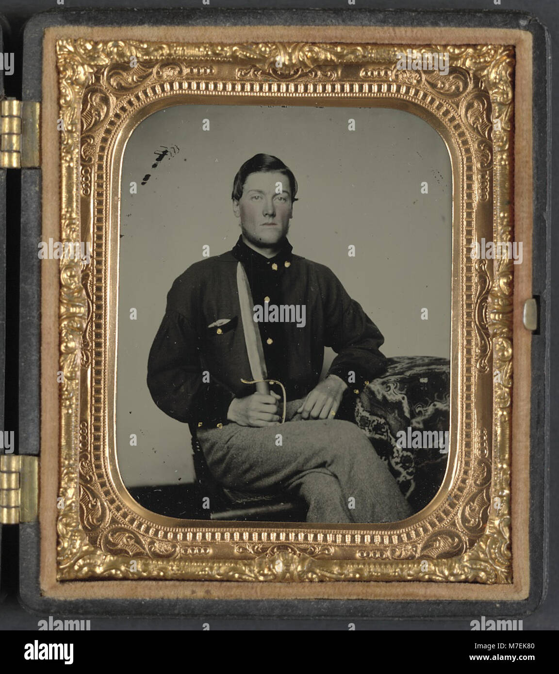Private David Bowman of Company I, 7th Virginia Cavalry Regiment, or Private Michael Bowman of Company B and Company H, 7th Virginia Cavalry Regiment, in uniform with knife LCCN2012645974 Stock Photo