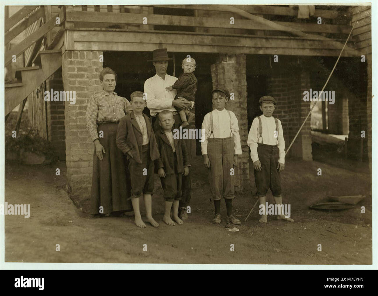 S.D. Ison and family. Father works some. Both boys on right of photo