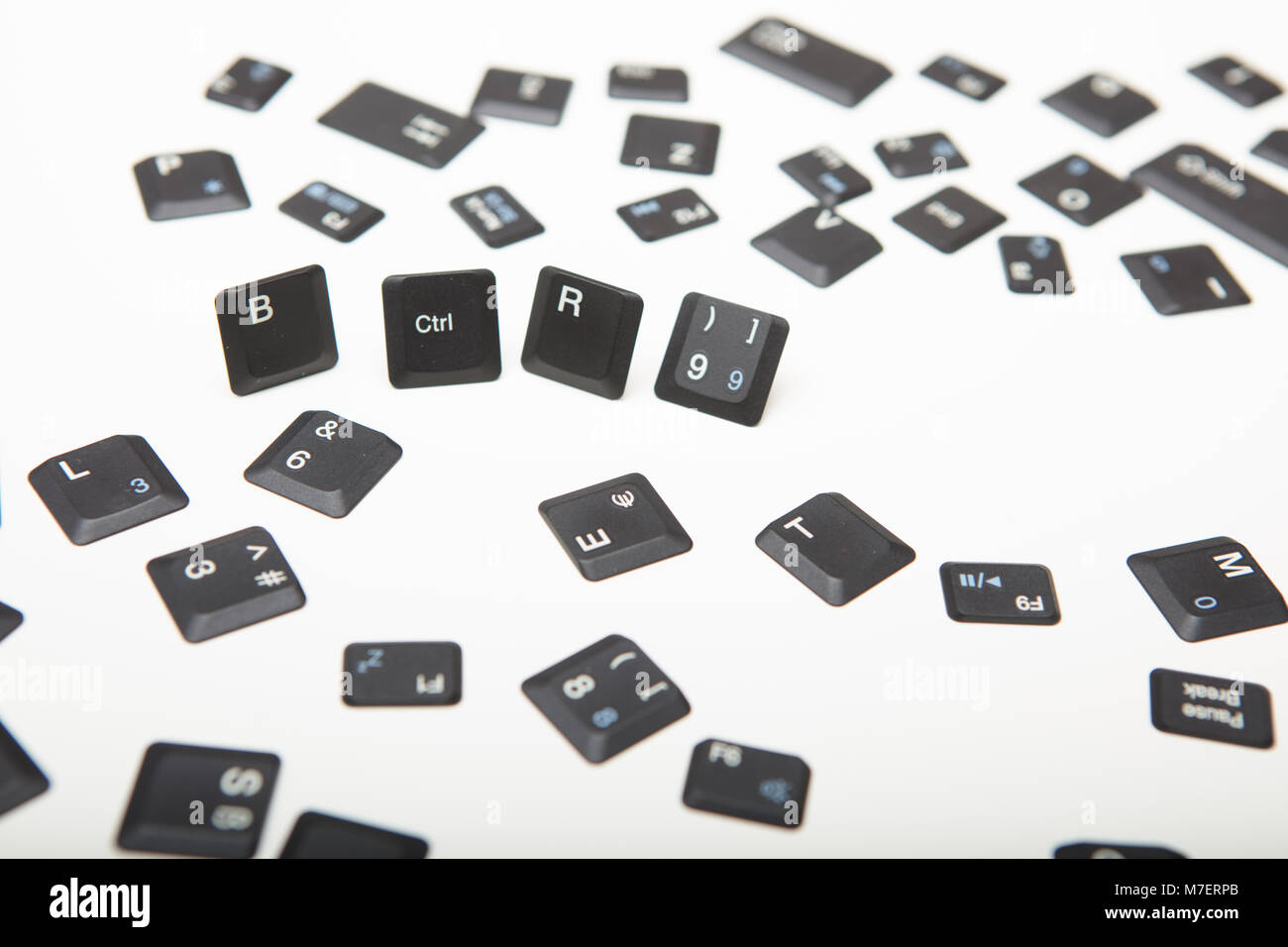 Computer keyboard composed of loose key covers from a computer with the