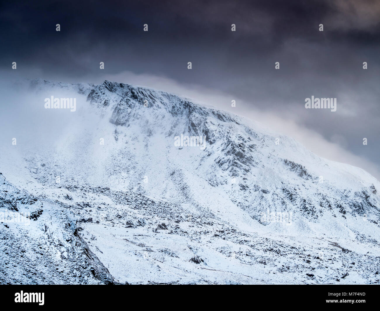 The summit of Moelwyn Mawr covered in snow and clouds. Stock Photo