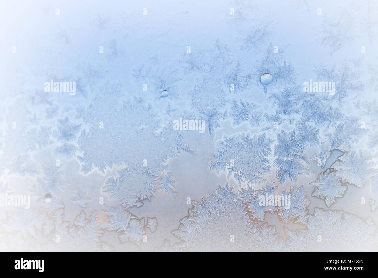 Winter frosty patterns on the frozen ice window Stock Photo - Alamy