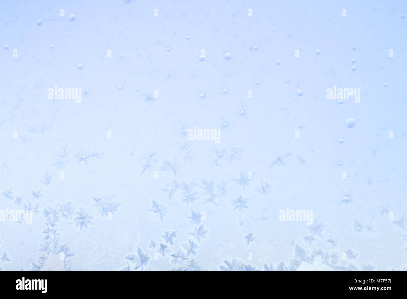Winter frosty patterns on the frozen ice window Stock Photo - Alamy
