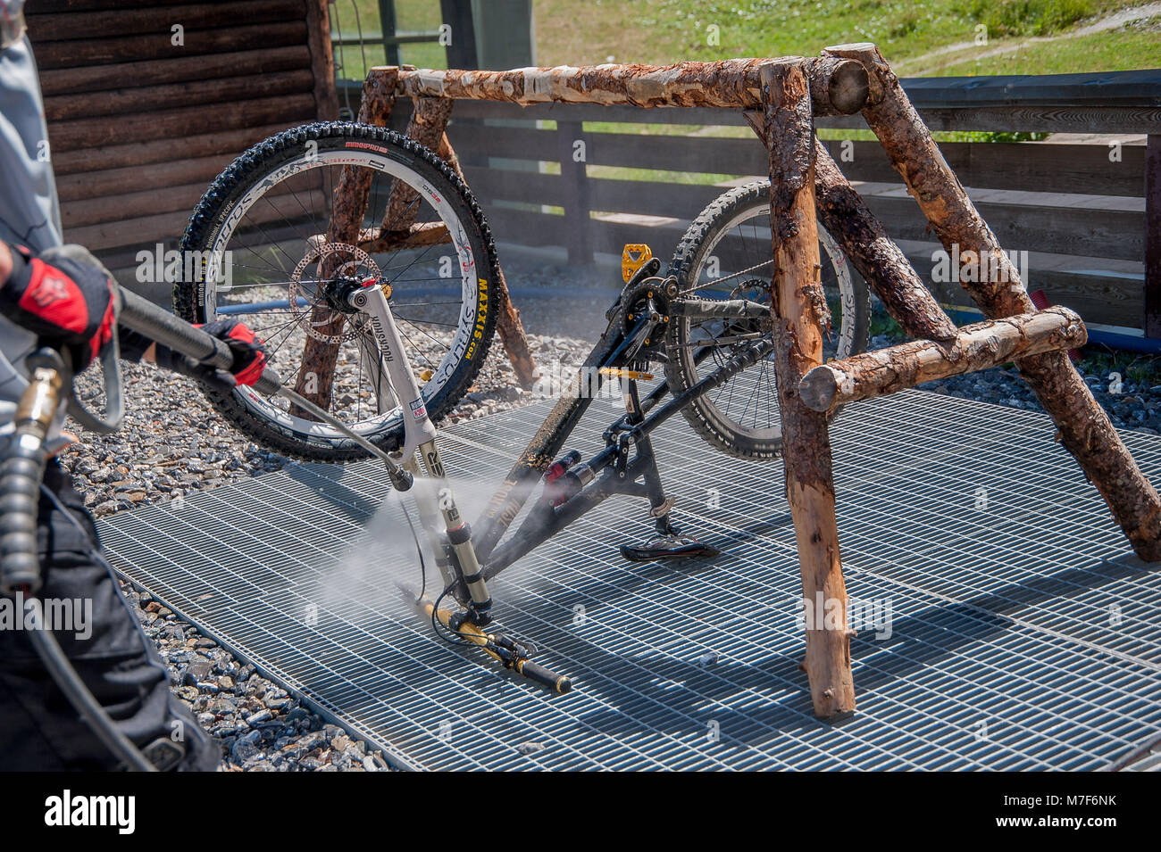 27 luglio 2015 Livigno italy : cleaning after bike ride through the dust Stock Photo