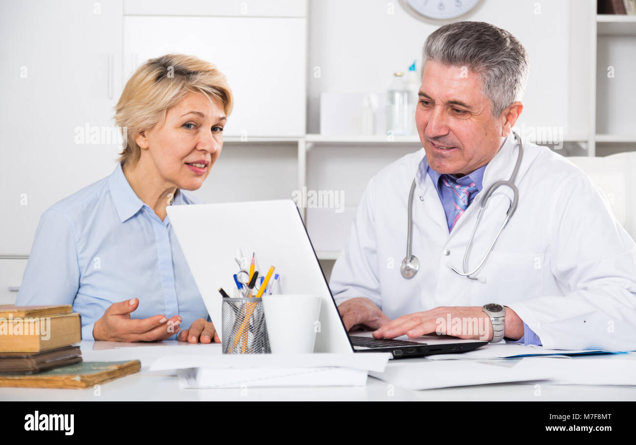 Mature woman visits doctor hi-res stock photography and images - Alamy