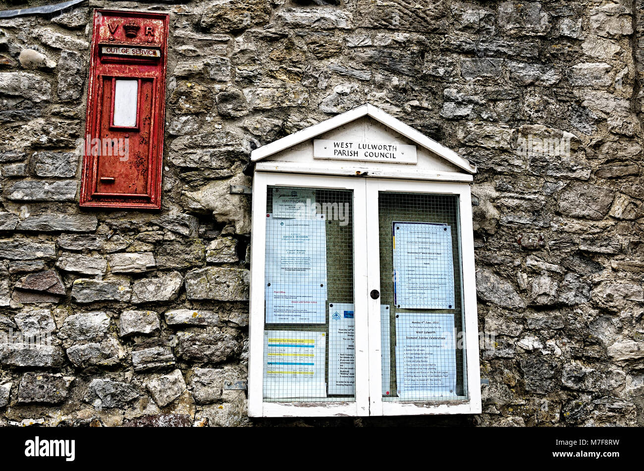 Notice Board and Victorian Post Box Stock Photo