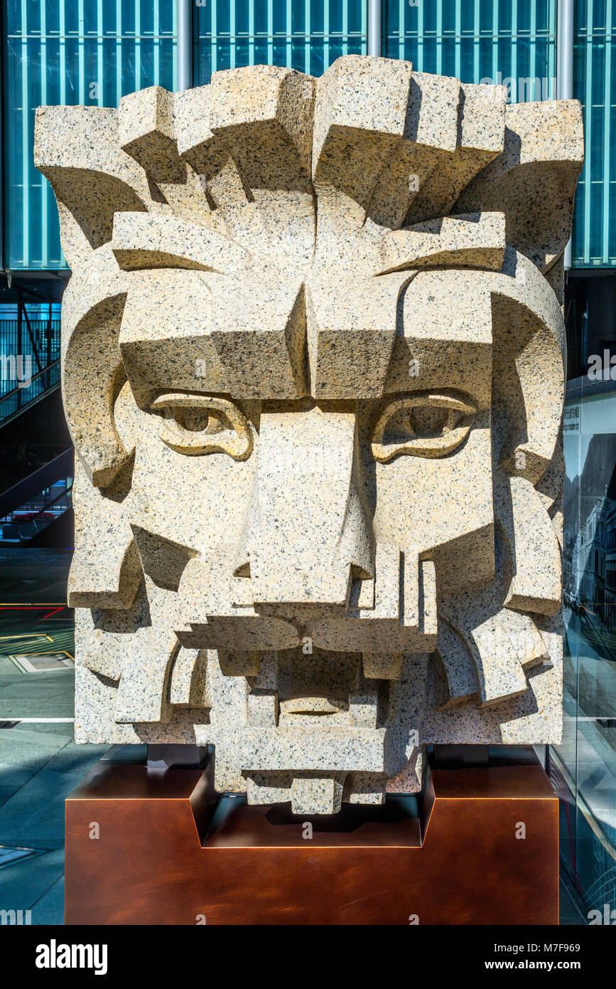 Giant Granite Lion Head Sculpture from 1930s guarding the Queen's Road Entrance to the HSBC Building, Hong Kong Stock Photo