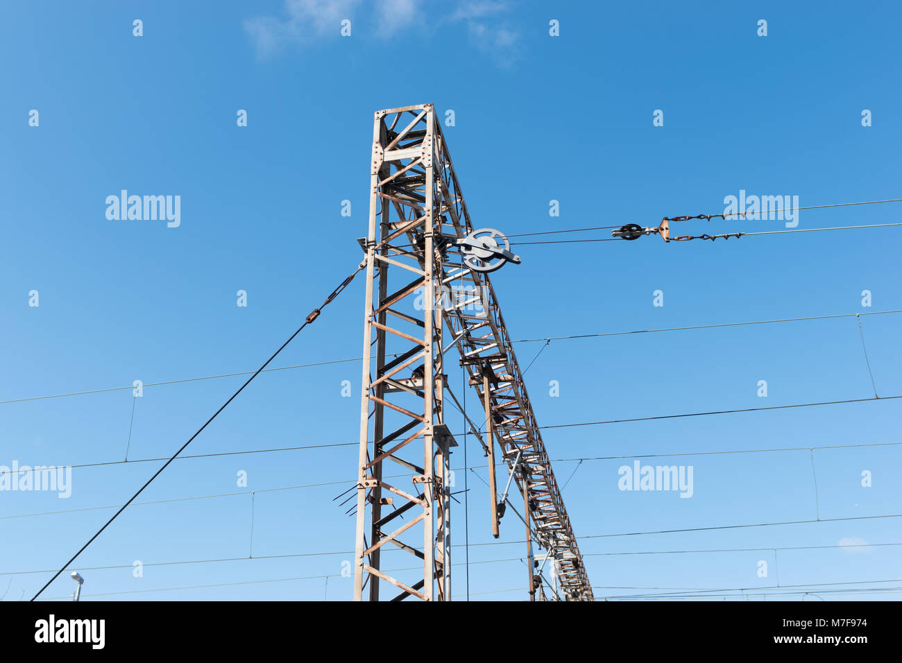 Train or railway power line support. Railway power lines with high voltage electricity on metal