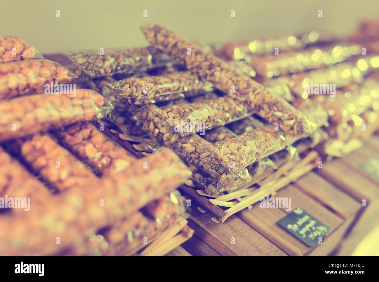 Photo of bags with dried fruits and nuts in the alimentacion store. Stock Photo