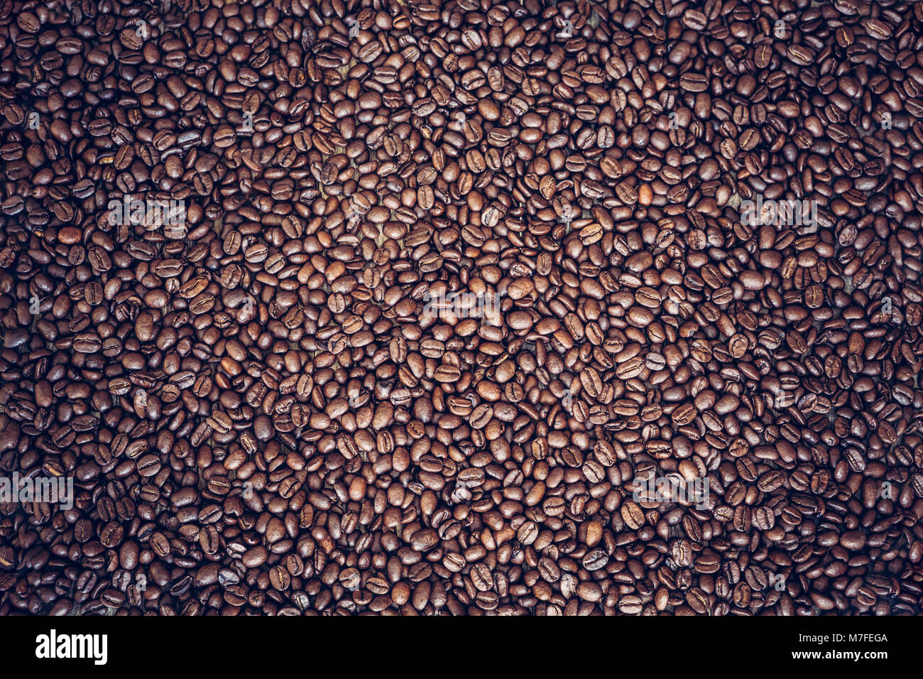 Rich brown roasted coffee beans background Stock Photo - Alamy