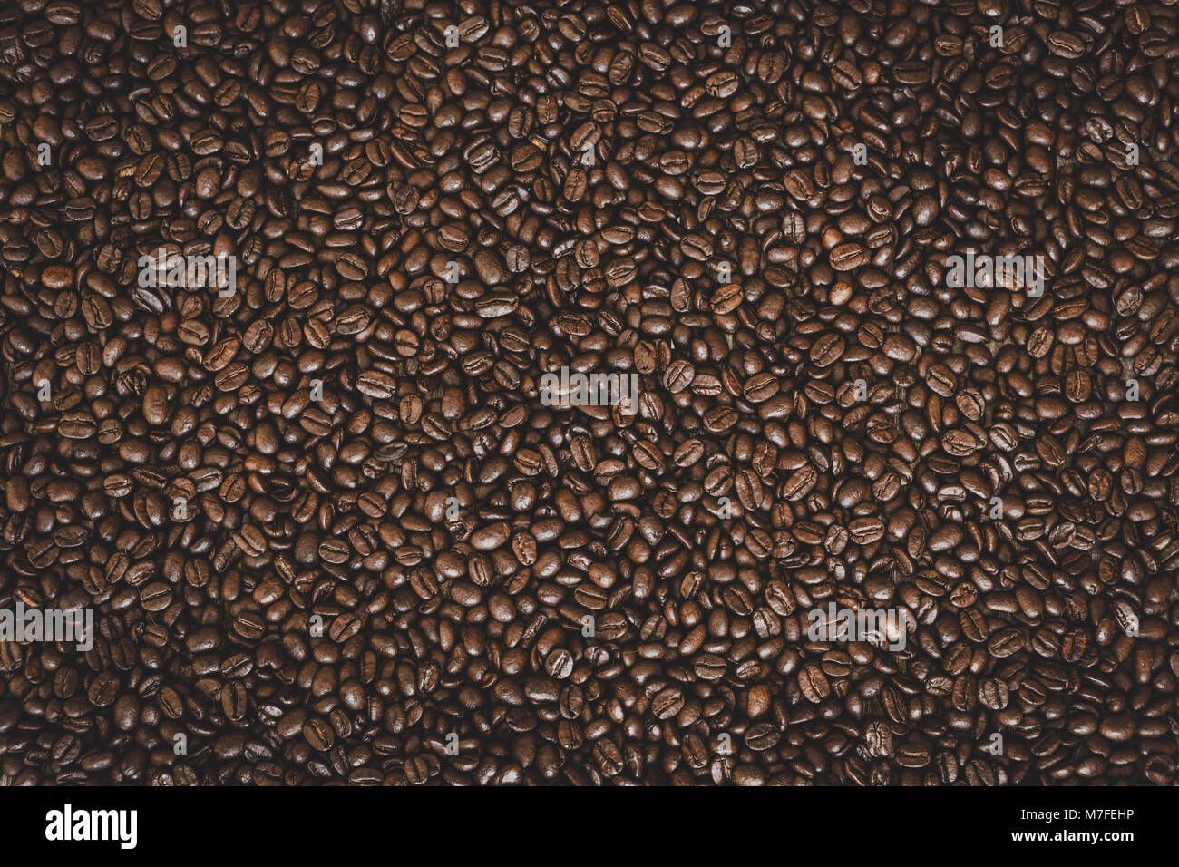 Rich brown roasted coffee beans background Stock Photo - Alamy