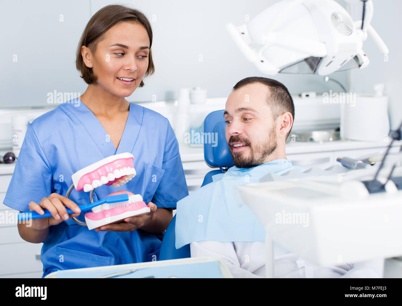 Orthodontist is telling about hygiene in hospital Stock Photo
