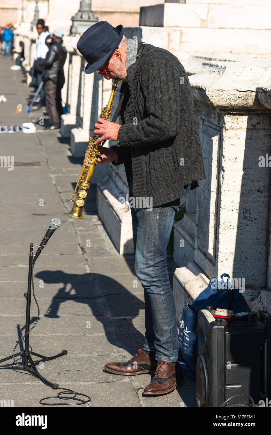 Street musician playing the saxophone on Rome street, Lazio, Italy