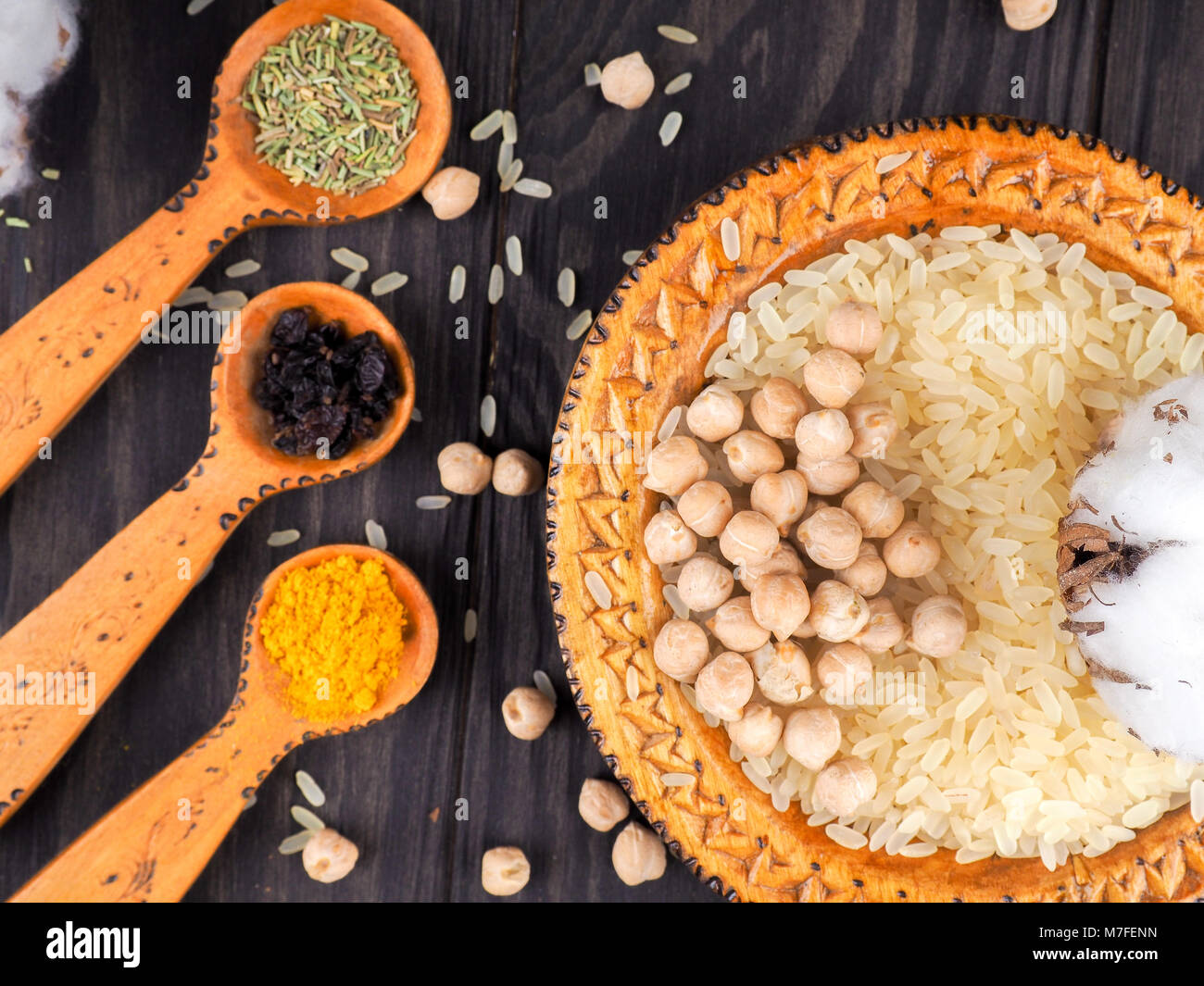 Asian cuisine, spices, rice, chickpeas and turmeric on a plate Stock