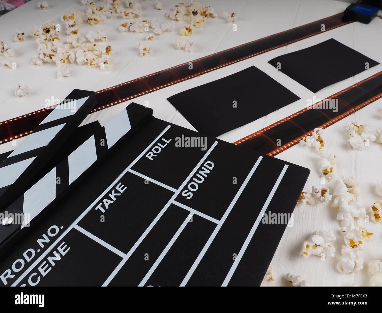 16 mm film reel on wooden background Stock Photo - Alamy