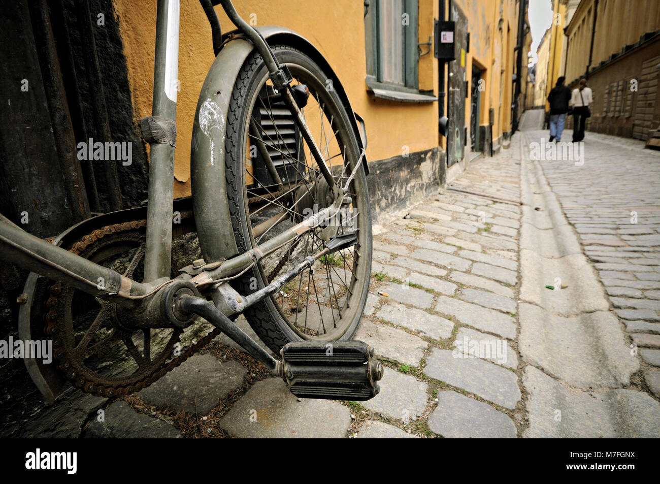Old bicycle parked in an alley of Gamla Stan, Stockholm, Sweden Stock Photo