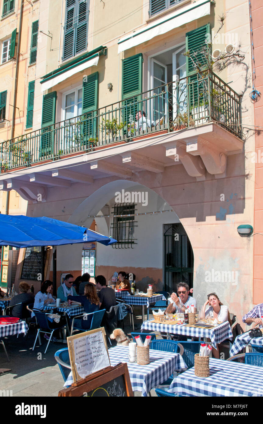 Restaurant tables on the promenade of Camogli, Italy Stock Photo