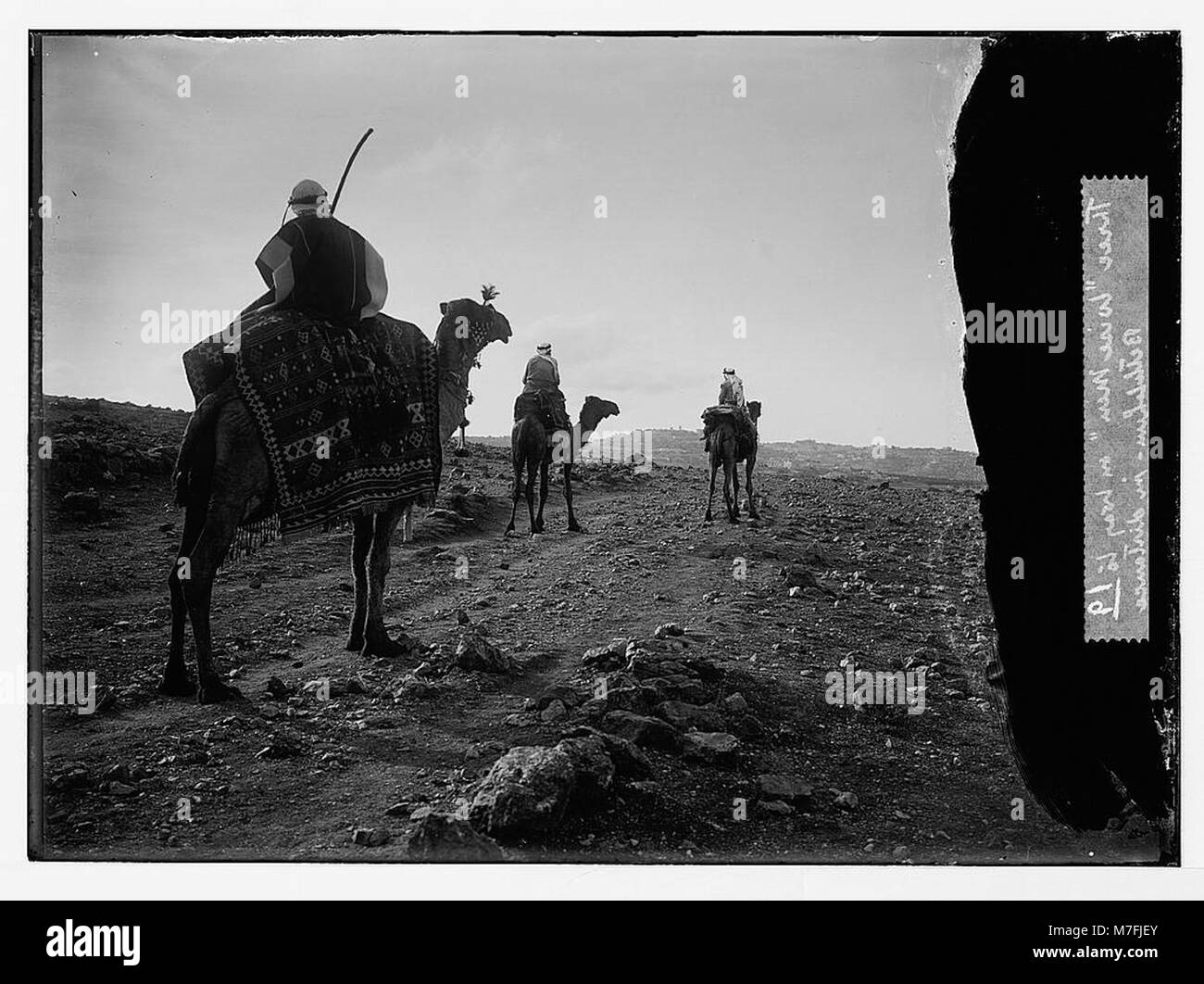 A depiction of the Three Wise Men traveling toward Bethlehem, seen in the distance, on their journey to visit the newborn Jesus. Stock Photo