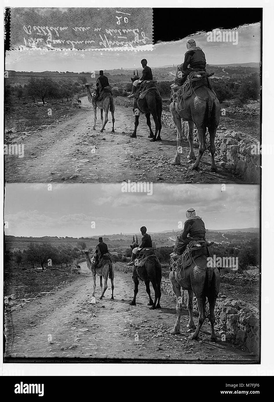 A photograph showing three camel riders approaching Bethlehem, with the ...