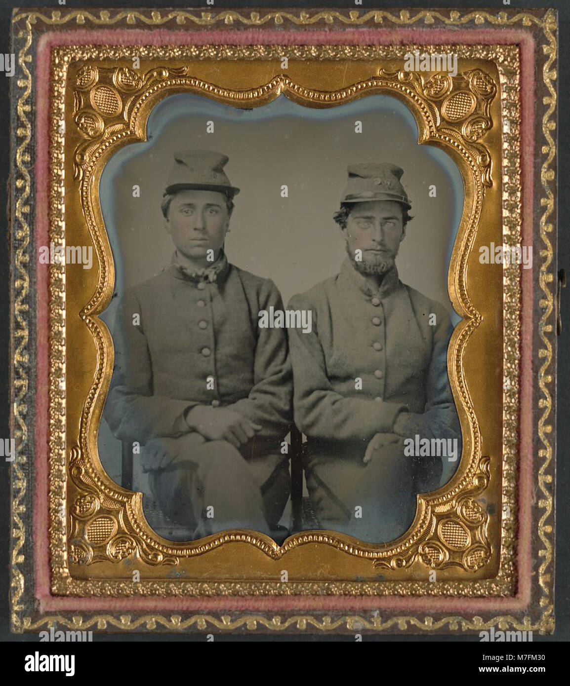 A historical photograph showing two unidentified Confederate soldiers ...