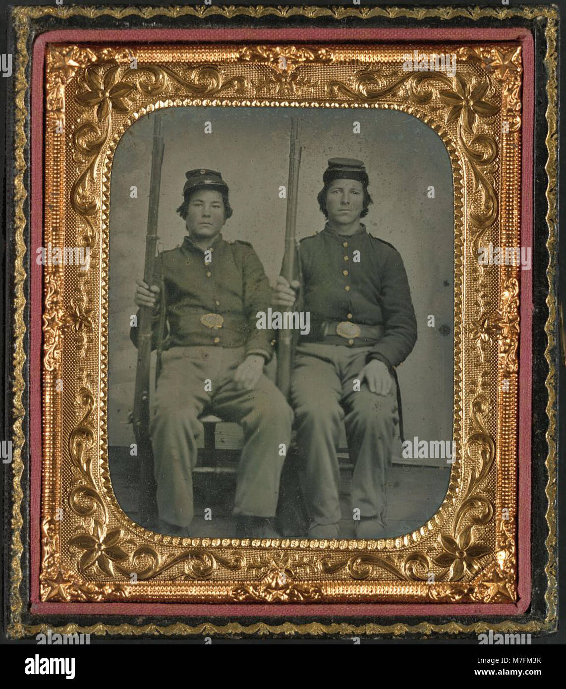 This image features two unidentified soldiers from the American Civil ...