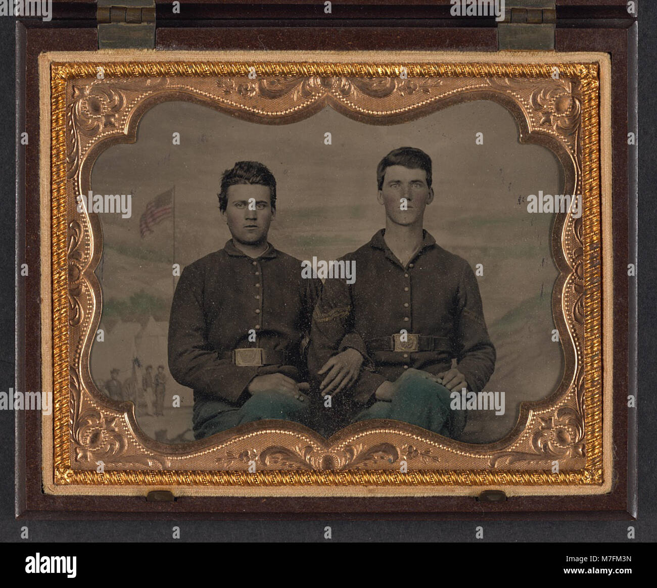 Two unidentified soldiers in Union uniforms in front of painted ...