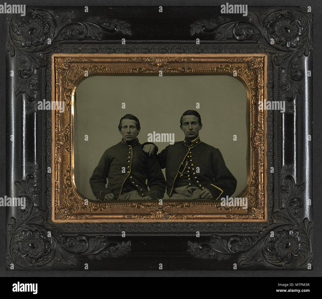 A photograph of two unidentified soldiers dressed in Union uniforms ...