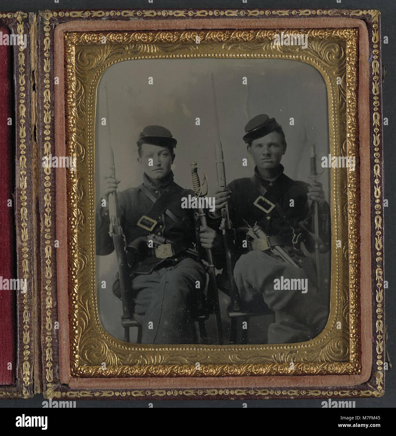 Two unidentified soldiers with Spencer carbines, 1860 sabers, and Colt Army revolvers, probably Union uniforms LCCN2011648539 Stock Photo