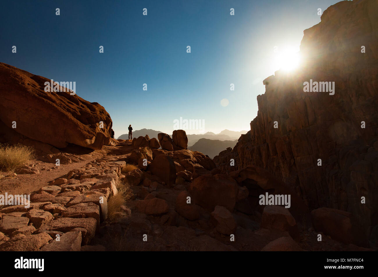 Man greets the beautiful sunrise on Mount Sinai in Egypt. Stock Photo
