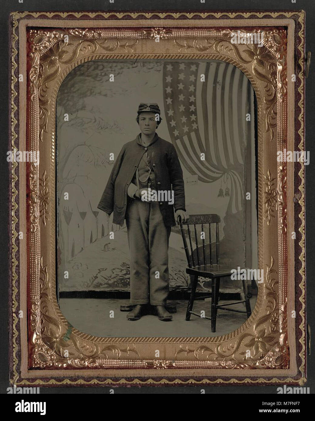 A photograph of an unidentified soldier in uniform, with his arm in a ...