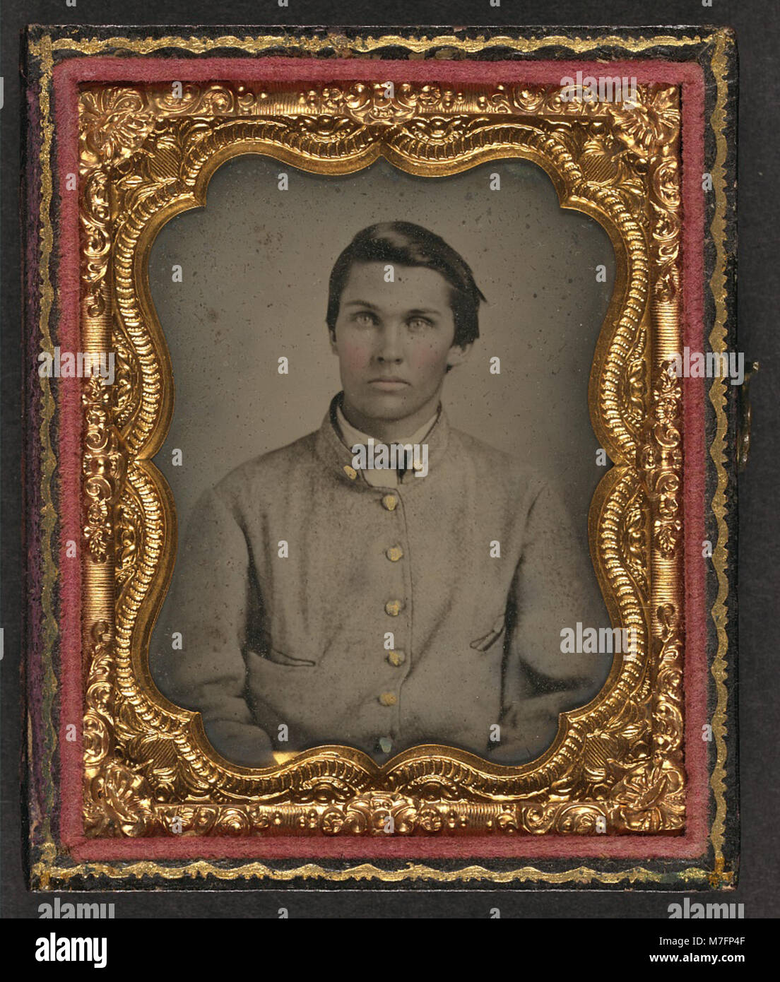 This image features an unidentified young soldier wearing a Confederate ...