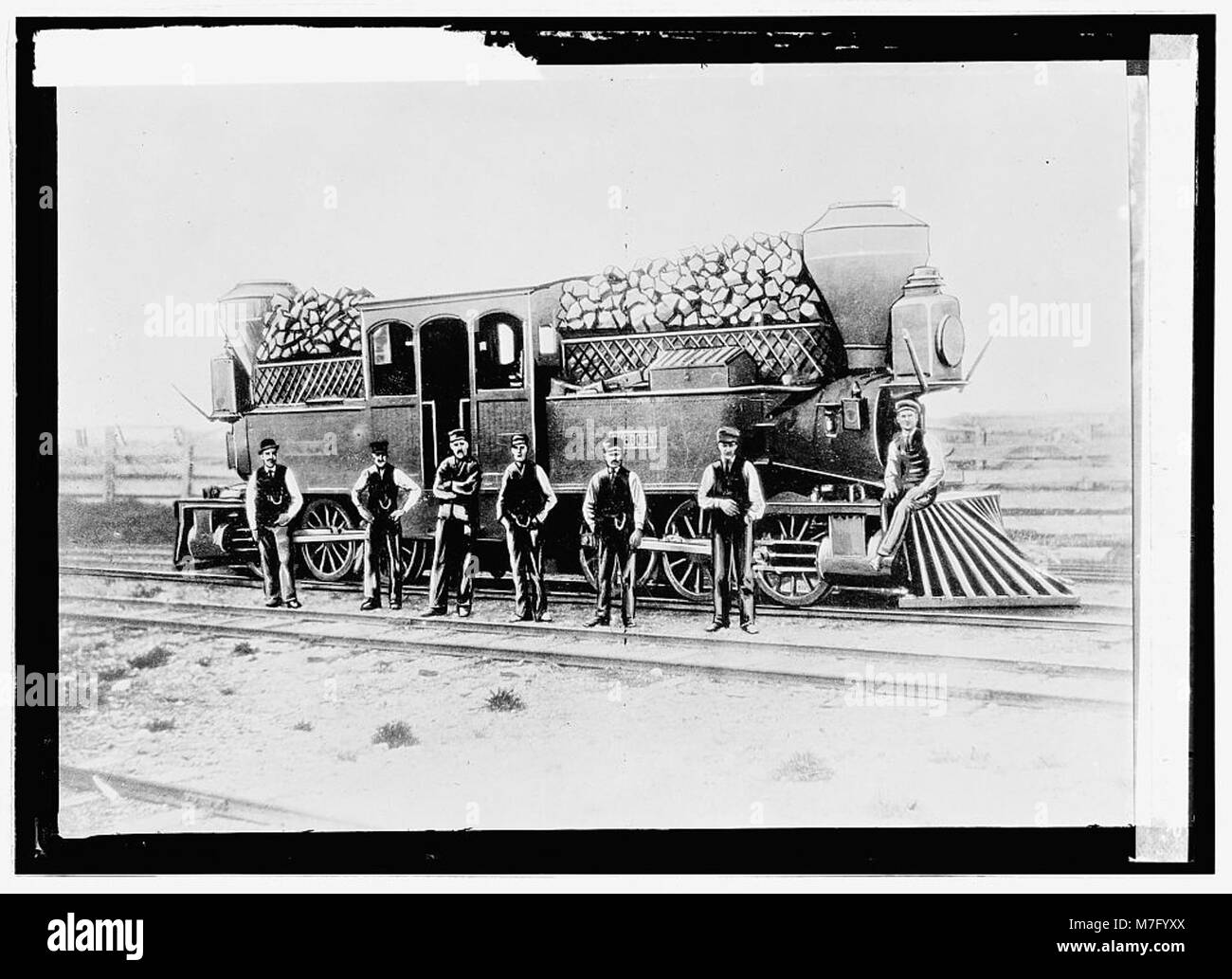 A photograph showing a woodburning engine operating on the Canadian ...