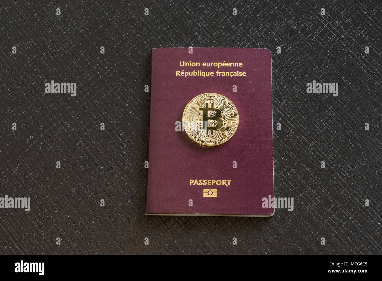 French passport with bitcoins Stock Photo