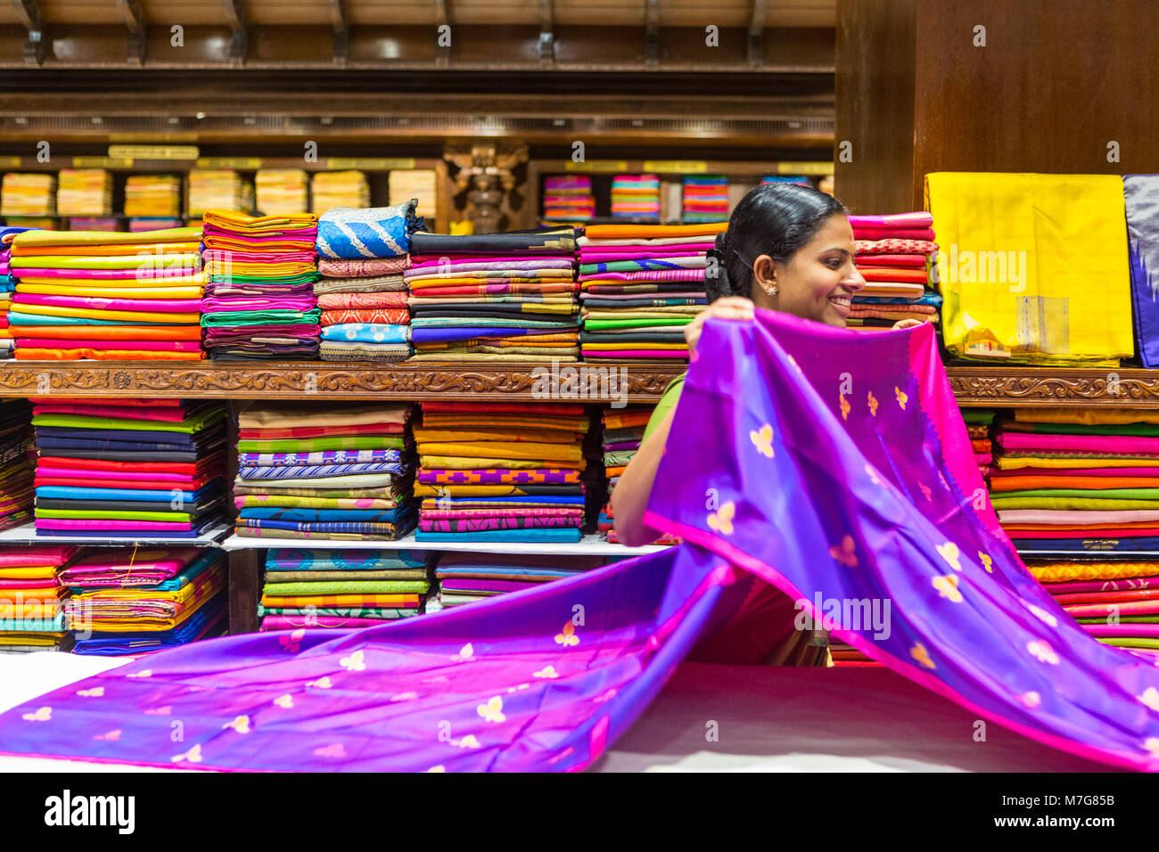 women-folding-material-at-pothys-store-in-trivandrum-stock-photo-alamy