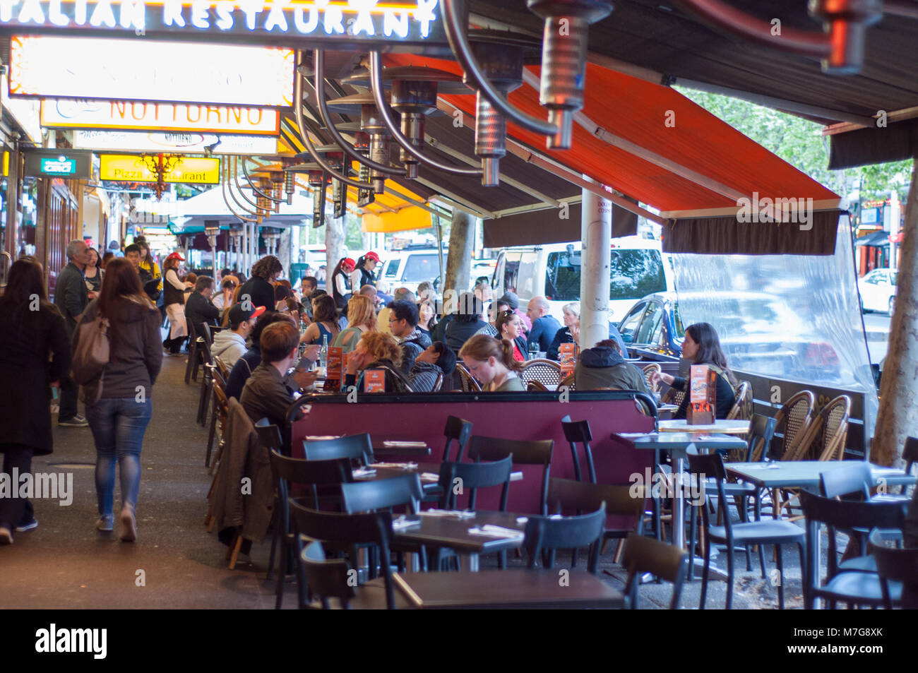 People Dining At Restaurants In Lygon Street Stock Photo