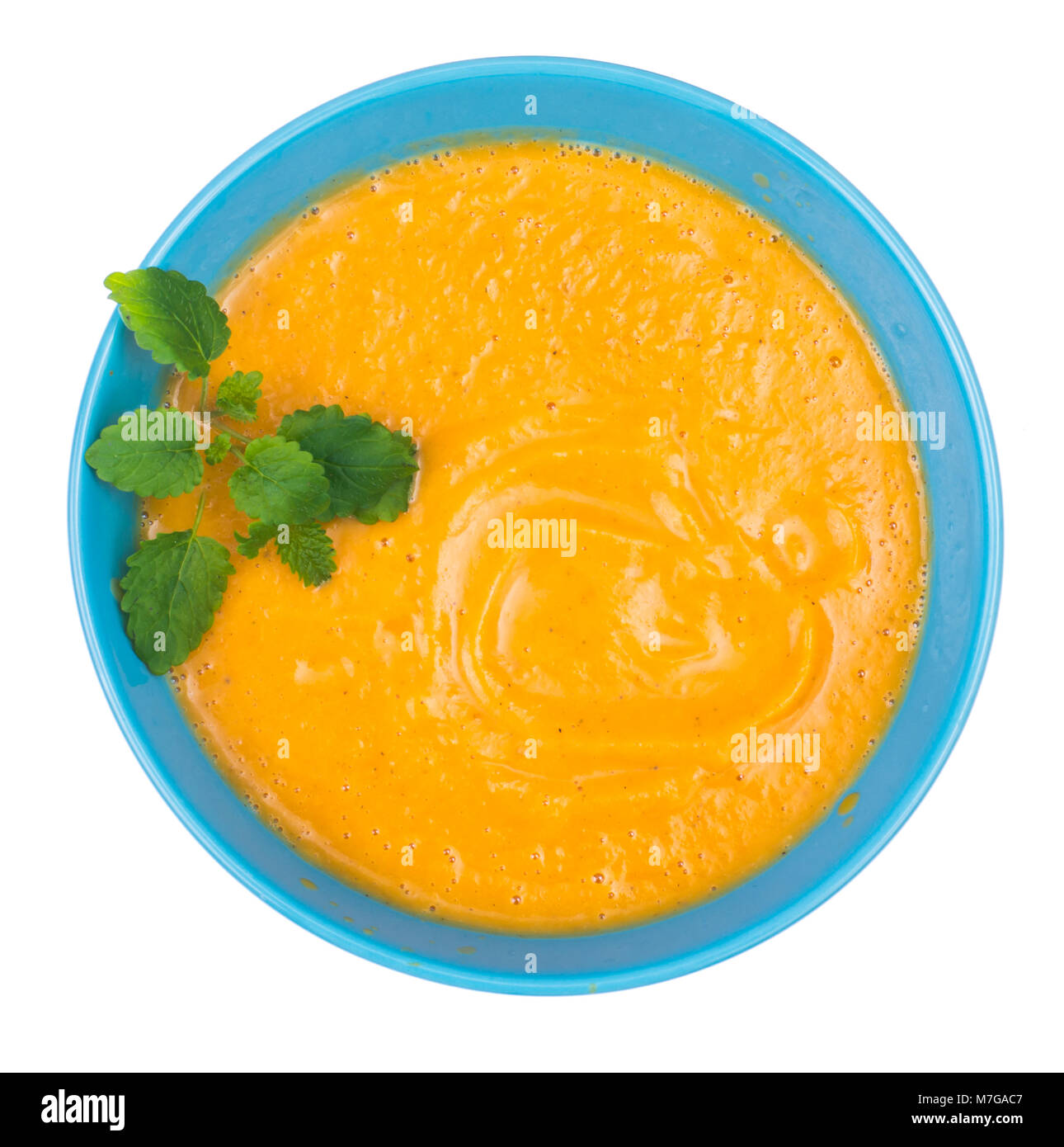 Lentil cream soup with fresh mint, top view Stock Photo