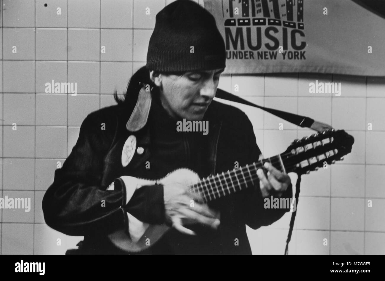 Street Musician playing in the subway at the 74th Street station in Jackson Heights, Queens, New York. Stock Photo