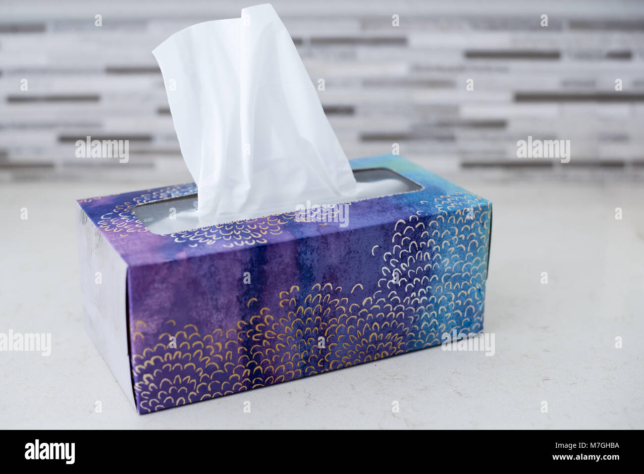 box of tissues on counter in bathroom ready for cold and flu season Stock Photo