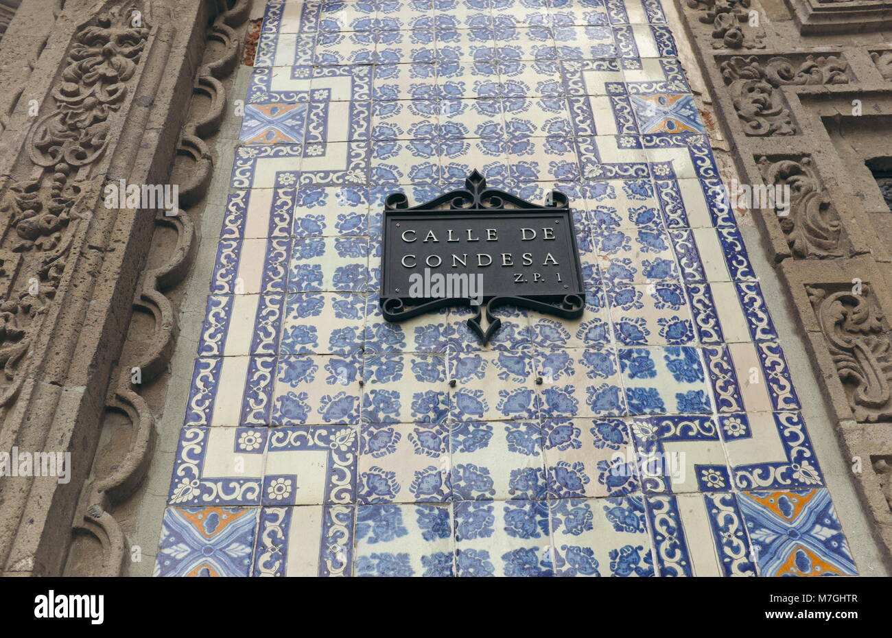 The Calle de Condesa street sign is affixed to the side of the House of Blue Tiles in the historic center of Mexico City, Mexico. Stock Photo