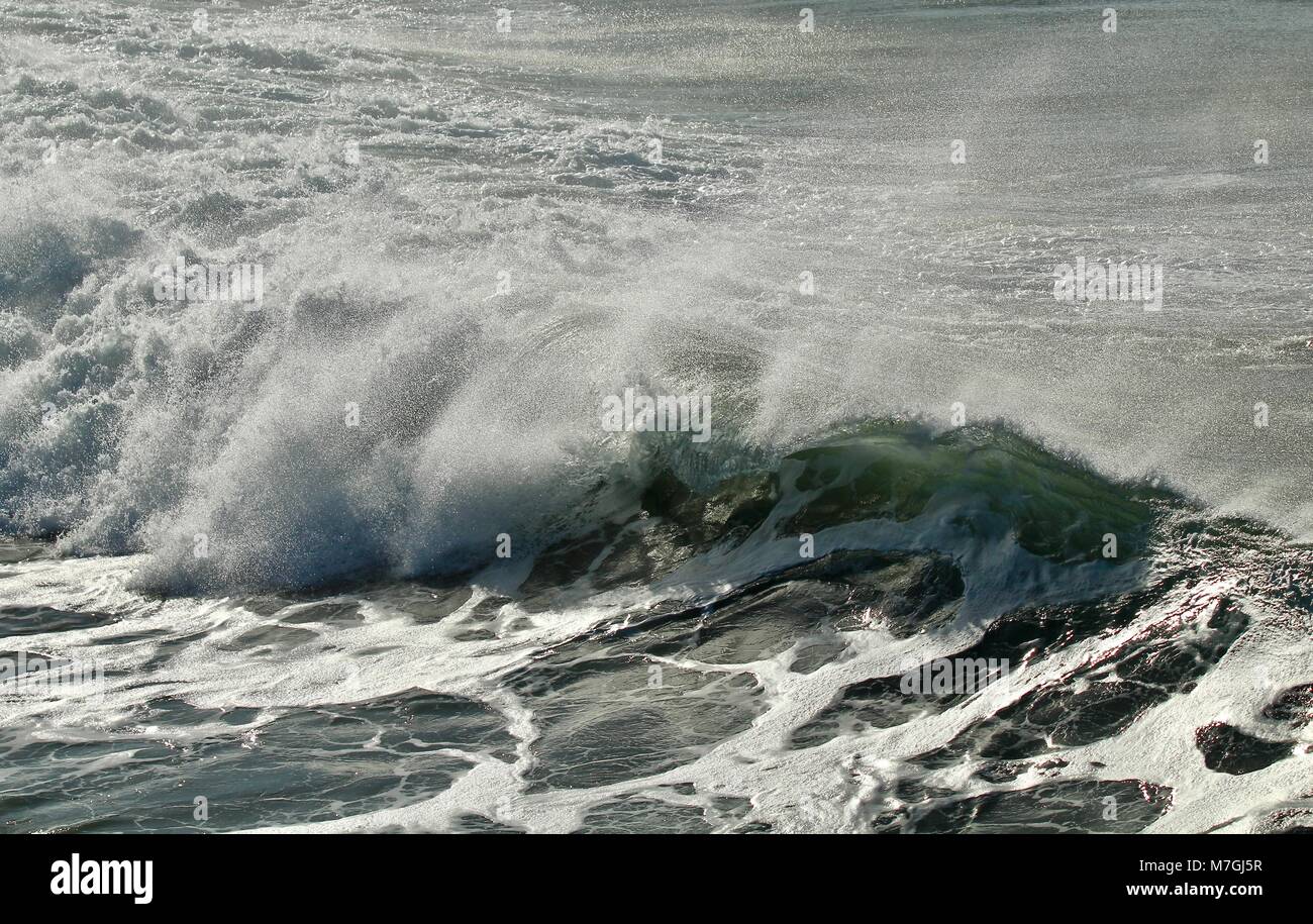 offshore wind waves creating spray Stock Photo
