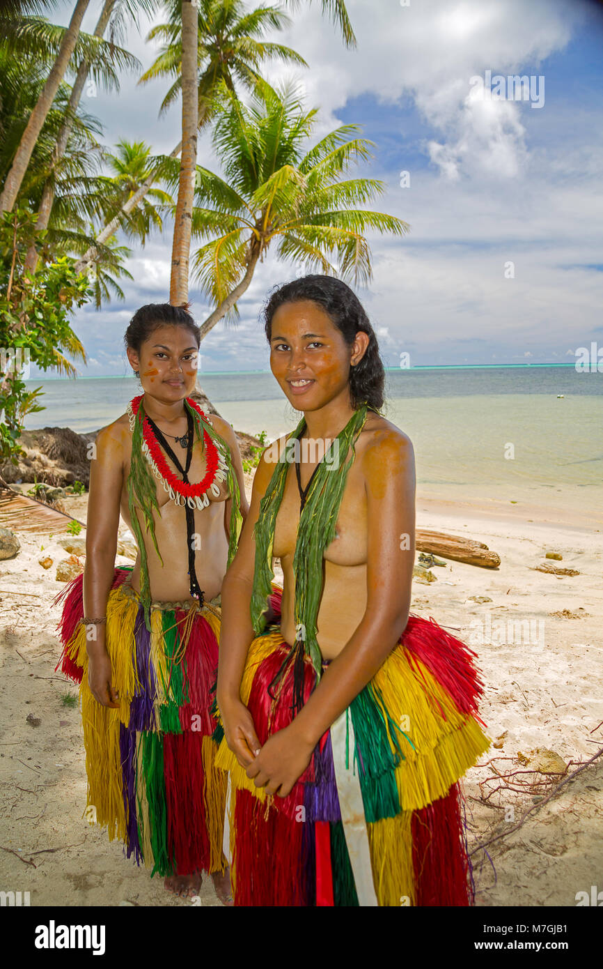 These two young girls (MR) are in a traditional outfit for cultural cerimonies on the island of Yap, Micronesia. Stock Photo