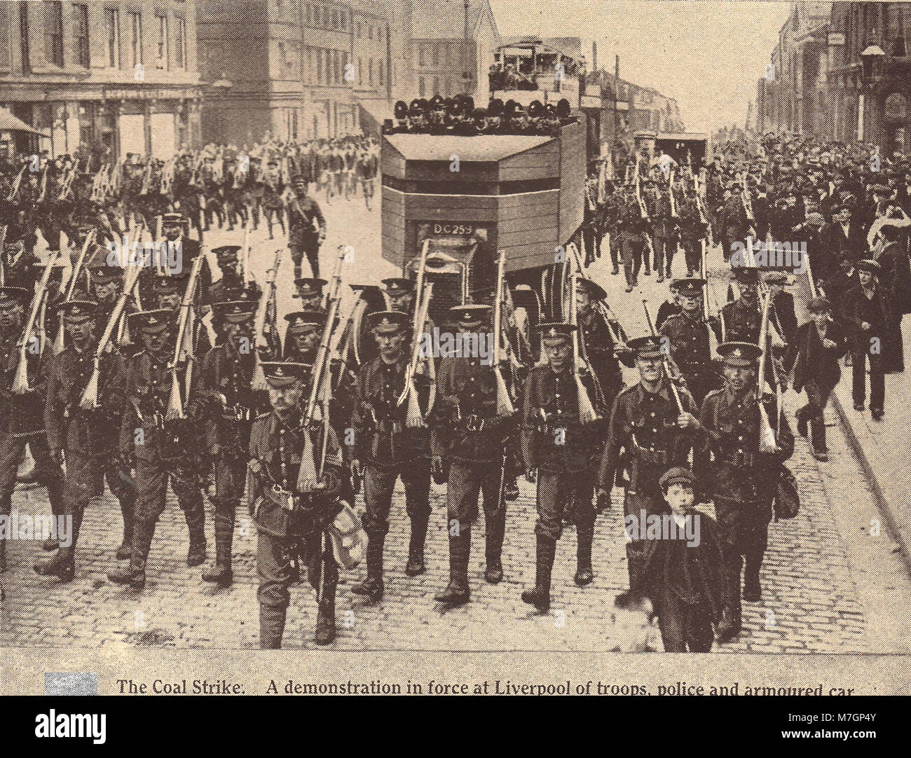 1911 news photograph showing the 1911 UK general transport  strike with troops marching in Liverpool (Bloody Sunday) Stock Photo