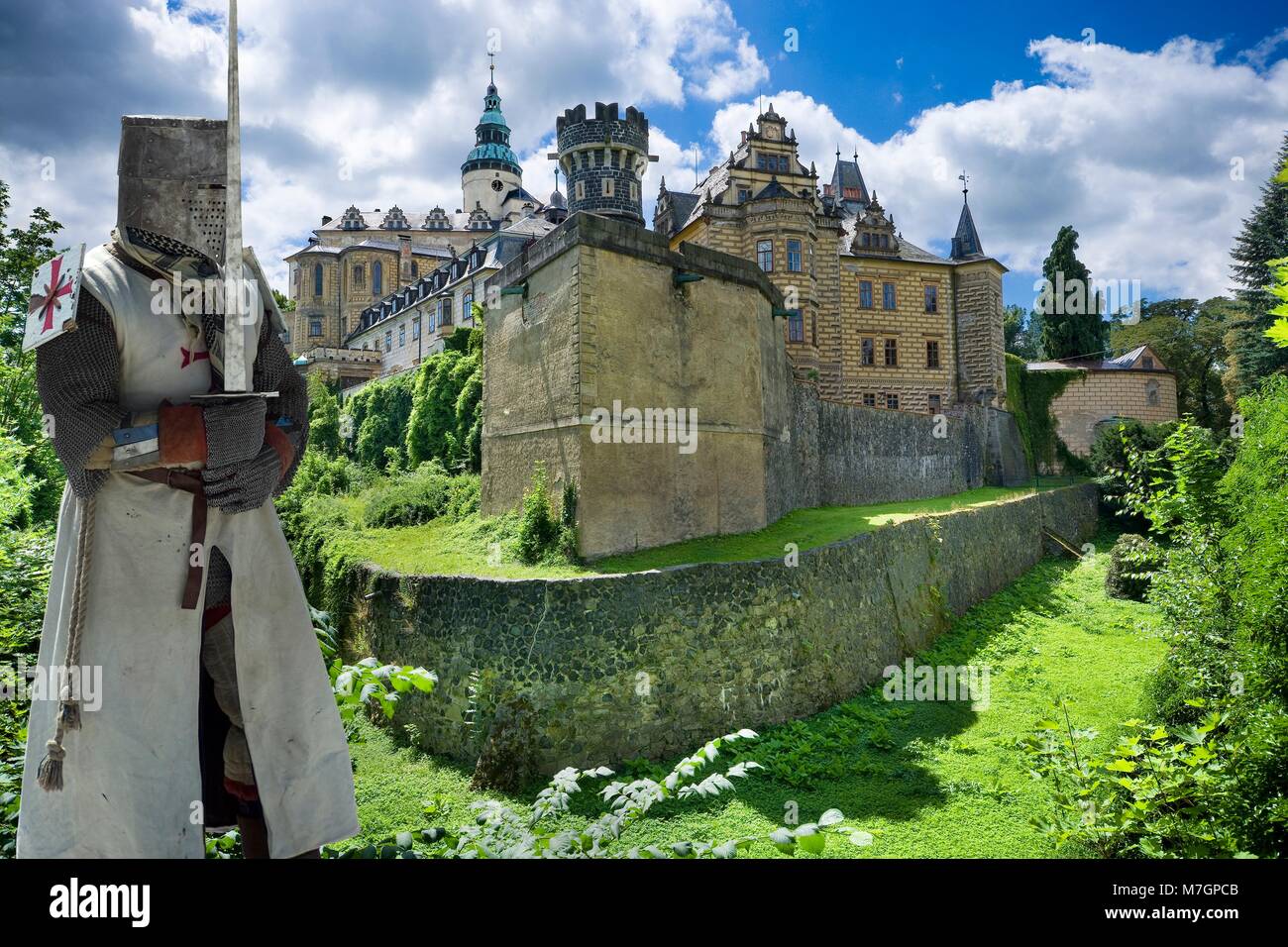 Medieval knight in front of Gothic and Renaissance style castle in Frydlant, Czech Republic Stock Photo