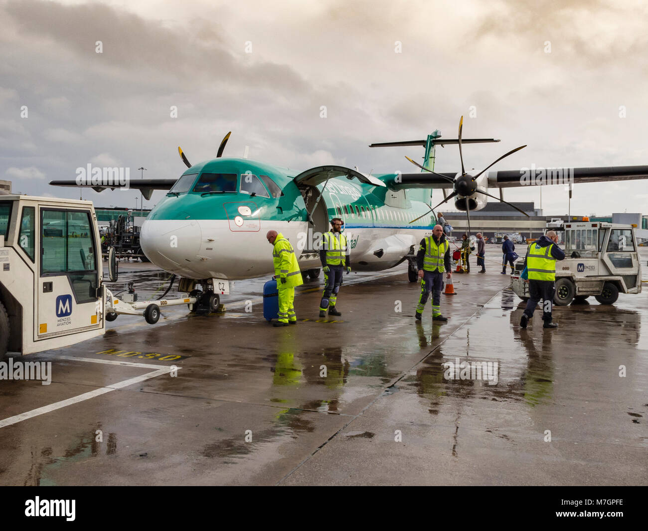 Stobart Air regional Irish airline ATR 72-600 twin propeller aircraft operating Aer Lingus Regional flights being loaded with passengers and baggage Stock Photo